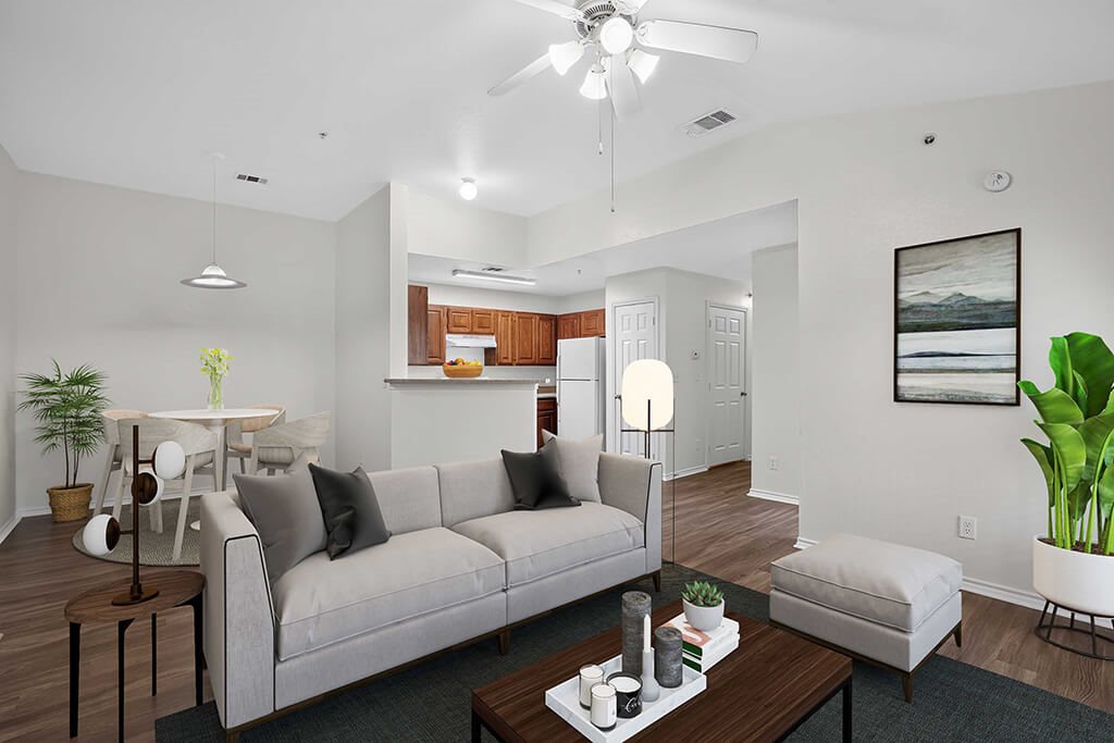 A living room with a grey couch and a coffee table.